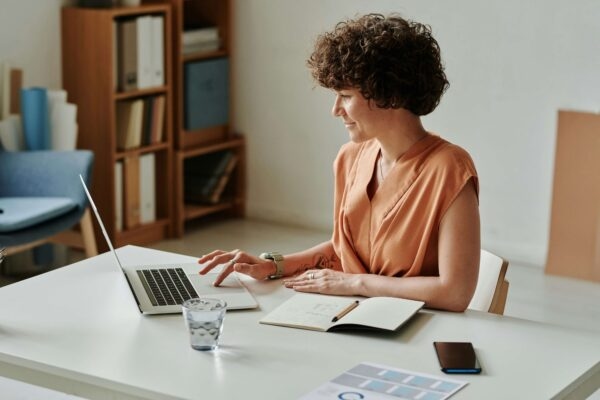 Woman at desk working on laptop