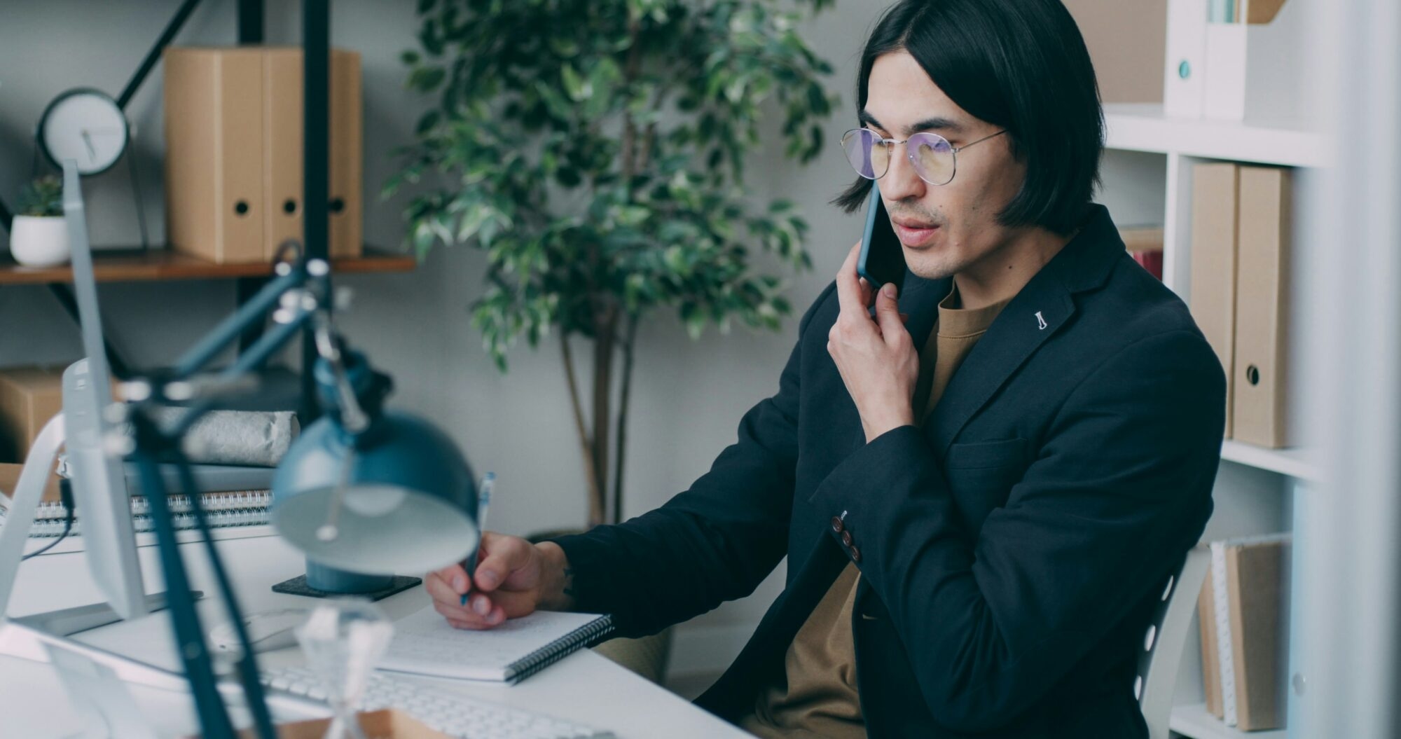 Man working at desk with laptop